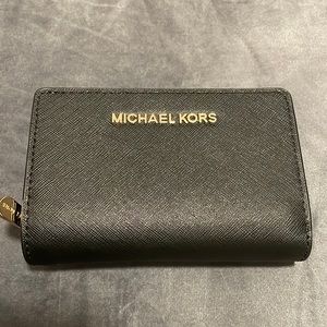 Women’s black and gold Michael Kors wallet
